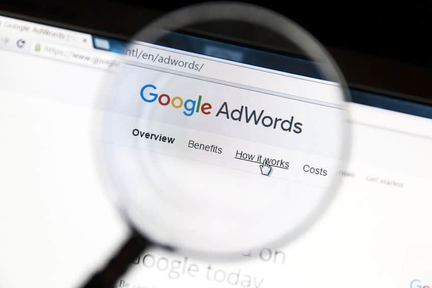 Google Adwords website under a magnifying glass